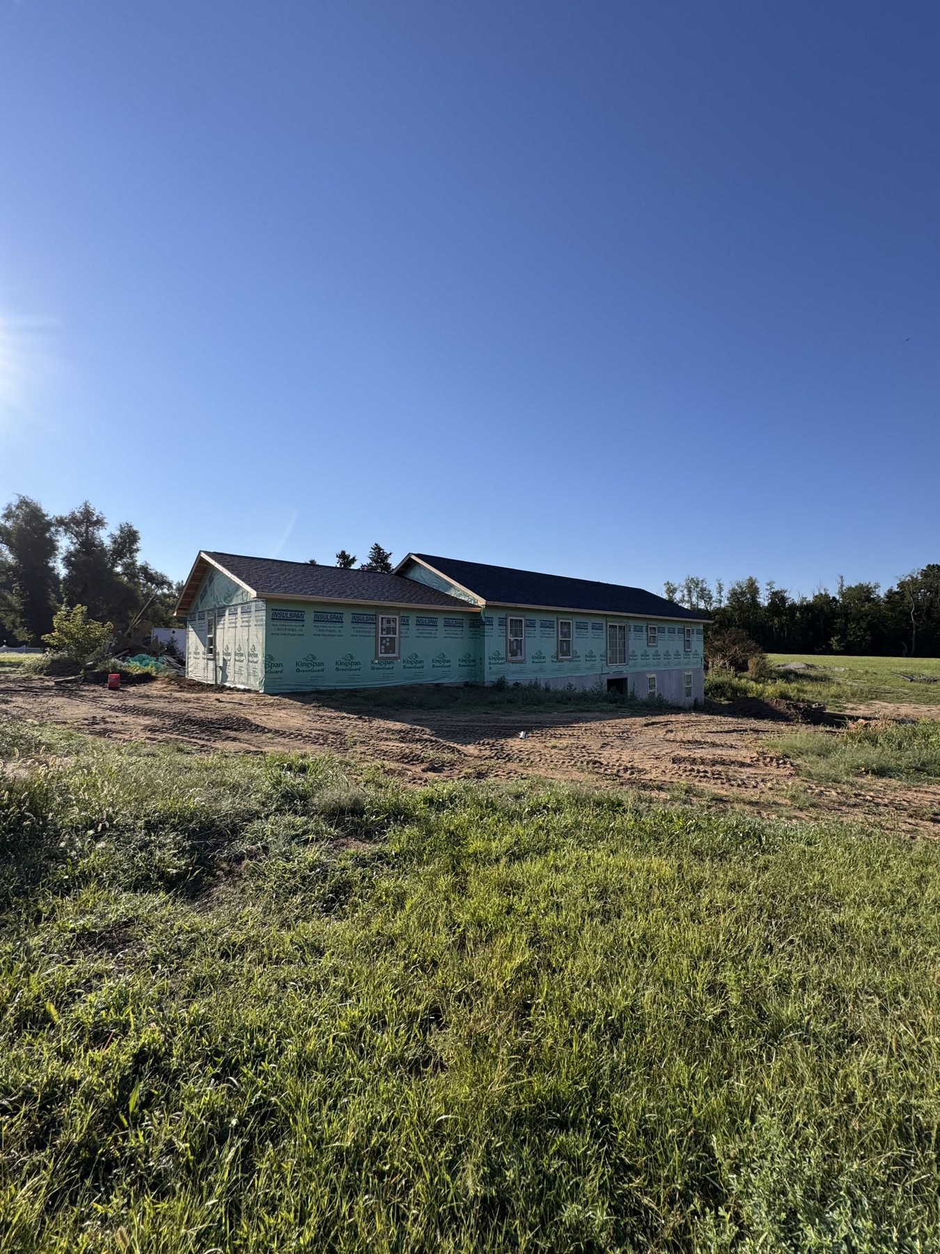 New home taking shape on an open lot