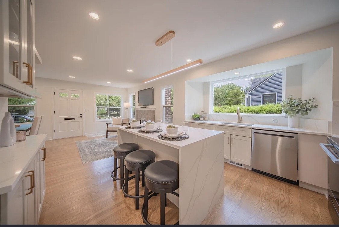 Bright kitchen with waterfall island